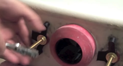 install new gasket, washer and nuts on tank bolts